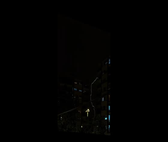 Lightning strike captured over residential buildings in Barcelona, Spain