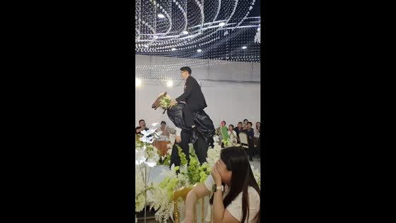 Groom enters wedding riding friends in horse costume in Shandong, China