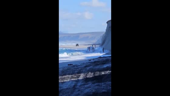 Rescuers’ all-terrain vehicle nearly swept into sea in Sakhalin, Russia