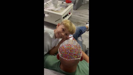 Glitter fun on dad's bald head