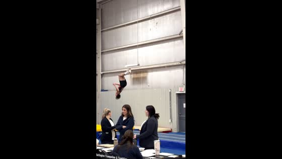 Gymnast loses balance during landing after mid-air rotation in Burlington, Canada