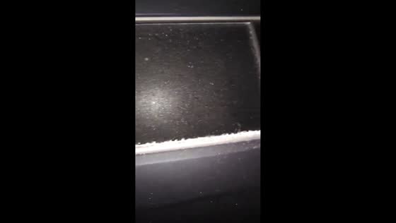 Overnight sleet buildup encases parked car in ice in Nicholasville, Kentucky, USA
