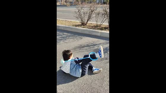 Boy trips while playing ankle skip ball in Liaoning, China