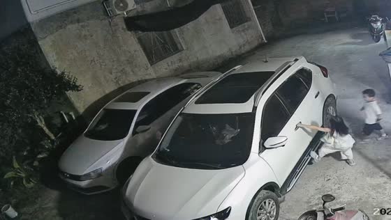 Girl starts a parked car while playing with her brother in Zhangzhou, Fujian, China