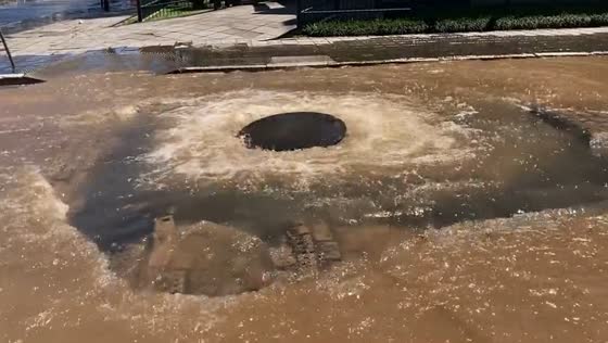 Manhole cover dislodged by severe flooding in Porto Alegre, Brazil