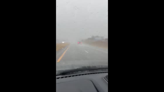 Heavy rain reducing visibility on I-35 South in Edmond, Oklahoma, USA