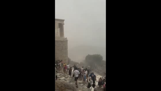 Sudden summer storm forces tourists to flee Athens' Acropolis in Greece