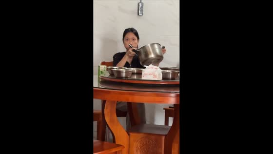 Woman chugs pot of soup with cheeks full in Fujian, China