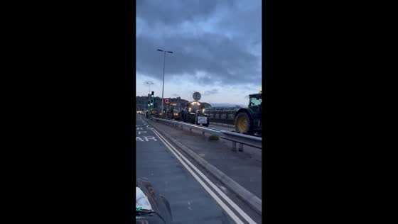 Tractors honk in protest on road in Dover, England, UK