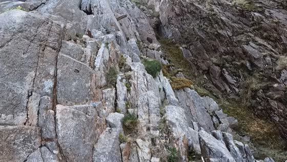 Climbers narrowly avoid falling boulders at Snowdonia National Park in Wales, UK