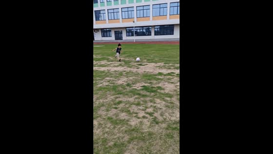 Boy slips on soccer ball during kick attempt in Jiangsu, China
