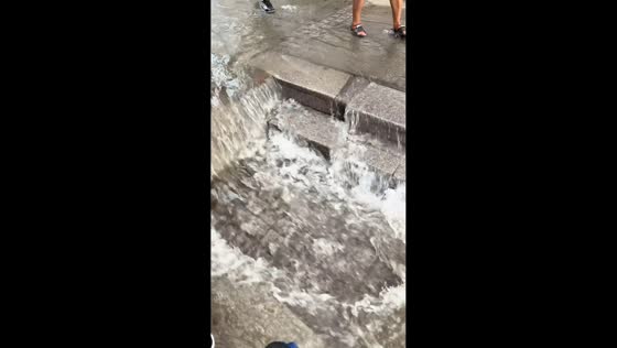 Flash flooding turns Harbin subway entrance into waterfall in Heilongjiang, China