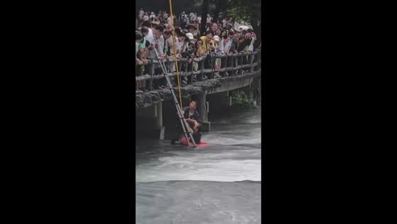 Tourist rescued after falling into rushing water at Xiaoqikong Scenic Area in Guizhou, China