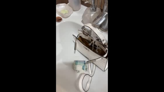 Child caught filling purse with water in Saratov, Russia