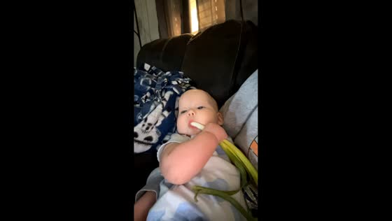 Baby uses green onion as pacifier in California, USA