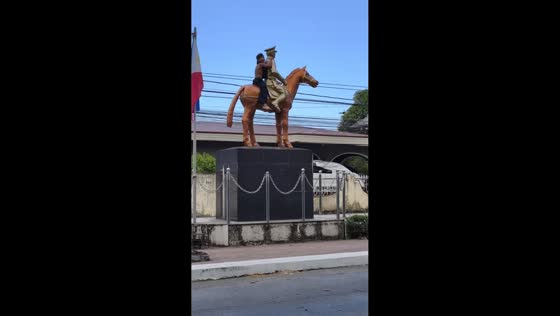 Boy quickly climbs down statue after joking mention of mayor in Lucena City, Philippines
