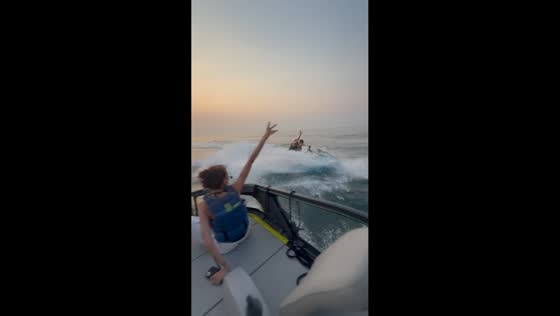 Jet ski splashes boaters on the sea in Dubai, UAE