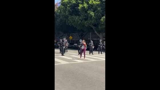 Daisy the Venice Healer skates with megaphone during No Kings-ICE protest in Los Angeles, USA