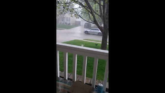 Heavy hail and rain sweep through Omaha neighborhood during severe storm in Nebraska, USA