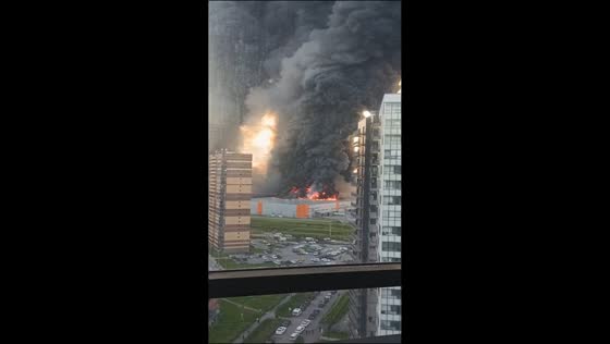 Massive warehouse fire sends towering smoke over St. Petersburg, Russia