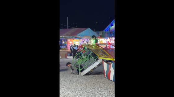 Man hilariously crawls under gate instead of lifting it to open in Huaraz, Peru