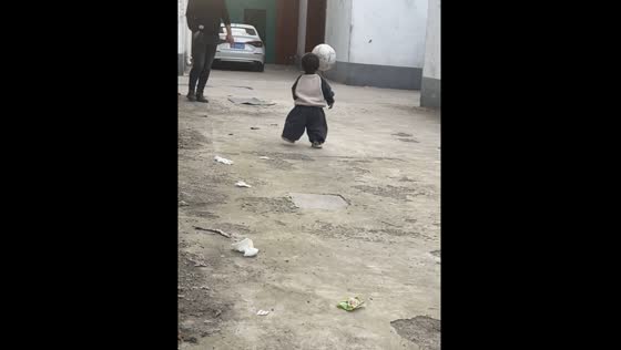 Children playing football with father, youngest son gets accidentally hit