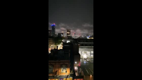 Forked lightning lights up Birmingham skyline during overnight storm in England, UK