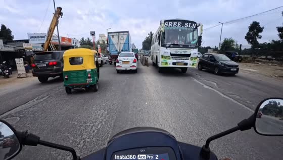Bus narrowly avoids hitting motorcyclist in Bangalore, India