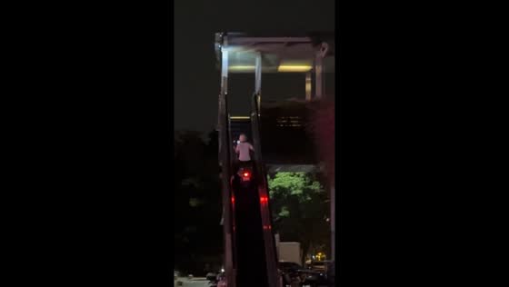 Motorcyclist rides up escalator in Guangdong, China