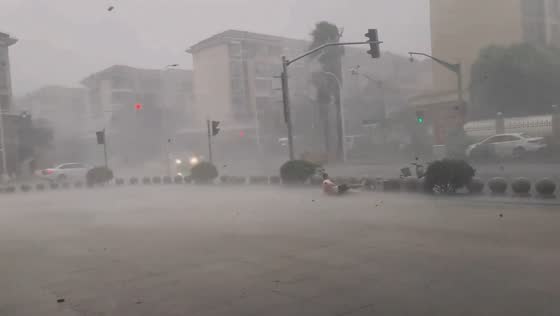 Man blown over by typhoon Bebinca in Shanghai