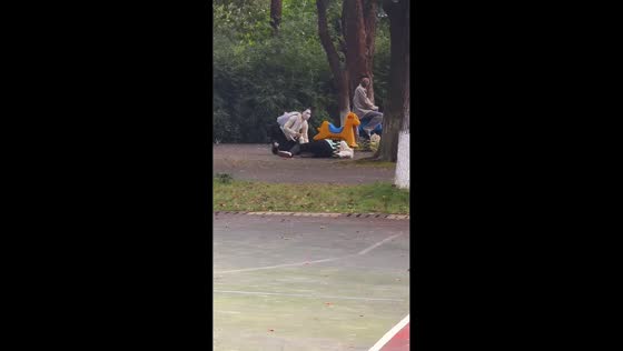 Two women hilariously slip moments apart at park in Hunan, China