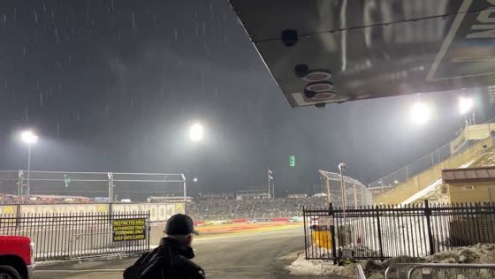 Sleet falls over crowd during race at Bowman Gray Stadium in North Carolina, USA