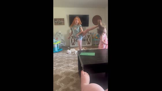 Child accidentally kicks sibling in head while dancing