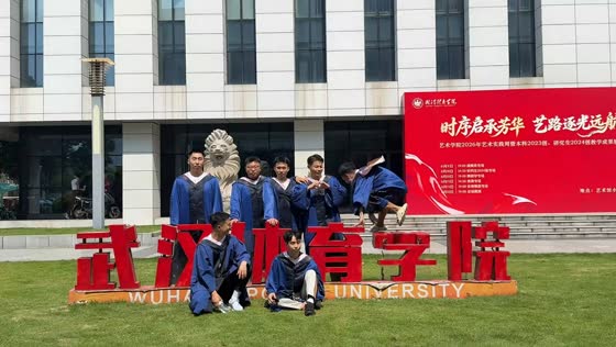 Graduate accidentally knocks over school sign during group photo in Wuhan, China