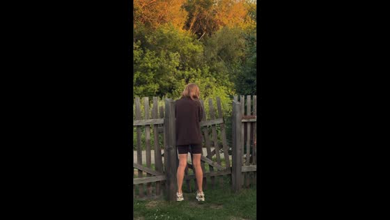 Fence door breaks while woman rides it in Altai Krai, Russia