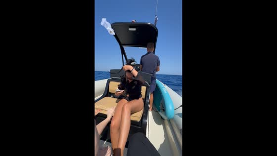 Ribbon sash flies into the sea during boat ride in Crete, Greece