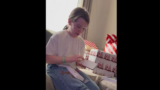 Child receives an iPhone as a gift in Doune, Scotland