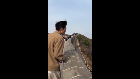 Visitor hit by spit during walk at Badaling Great Wall in Beijing, China