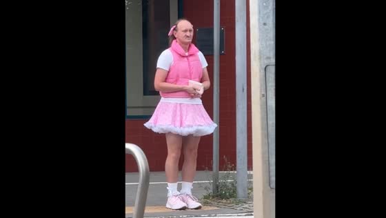 Man dressed in female clothes and ponytails captivates in Gdynia