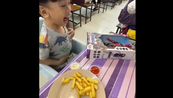 Child's joyful reaction to Spiderman toy in Indonesia