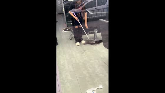 Barber shop intern hides hair under chair in Inner Mongolia, China