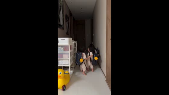 Triplets practice walking hand-in-hand before daycare in Seoul, South Korea