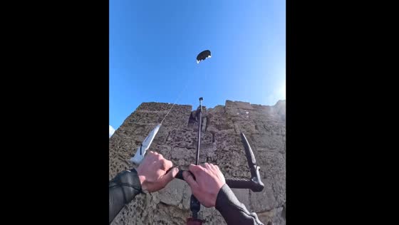 Kitesurfer rides up building then launches into the air in France