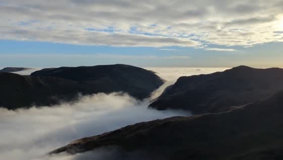 Incredible fog-covered view while hiking on Helvellyn Mountain, UK