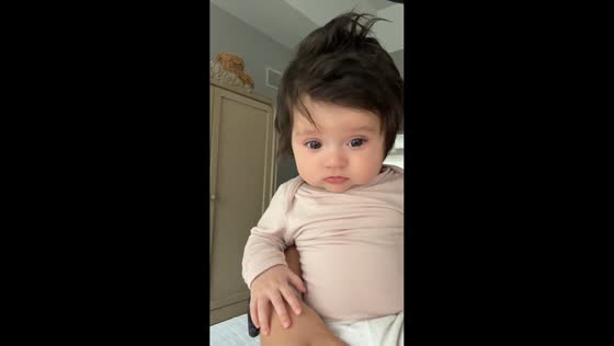 Baby tears up unexpectedly while being held in Douglasville, Georgia, USA