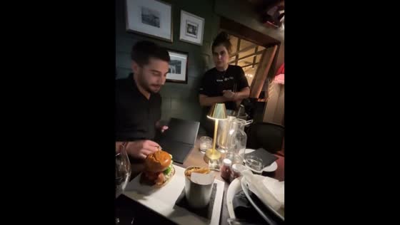 Waitress brings page less menu in Martha’s Vineyard, USA