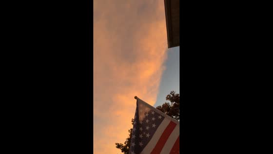 Golden-orange sunset during Tropical Storm Imelda in Buffalo, New York, USA