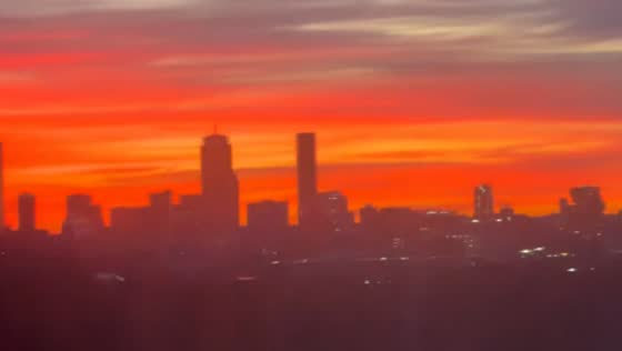 Vivid winter sunrise lights up the Boston skyline in Cambridge, Massachusetts