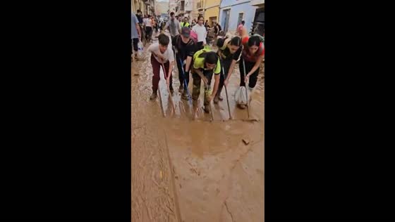 Residents of Paiporta clean streets after flooding