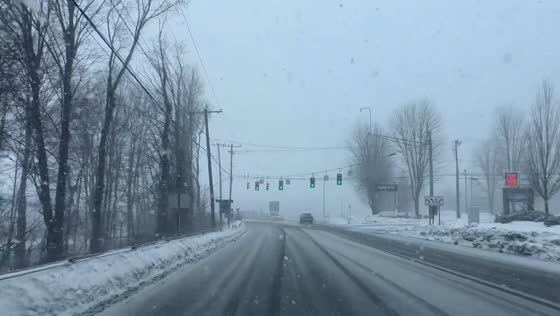 Heavy snowfall creates low-visibility driving conditions in New York, USA